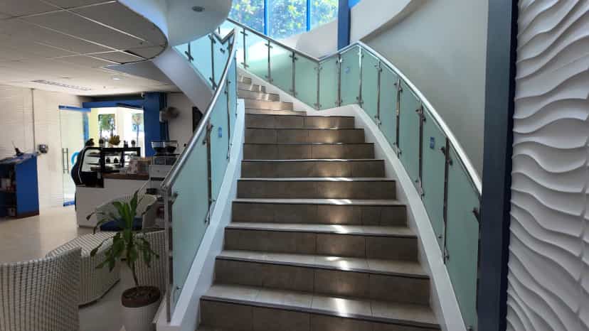 Lobby spiral staircase and wave-patterned wall