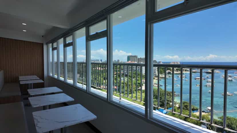 A row of window seats with a sweeping view of the bay below