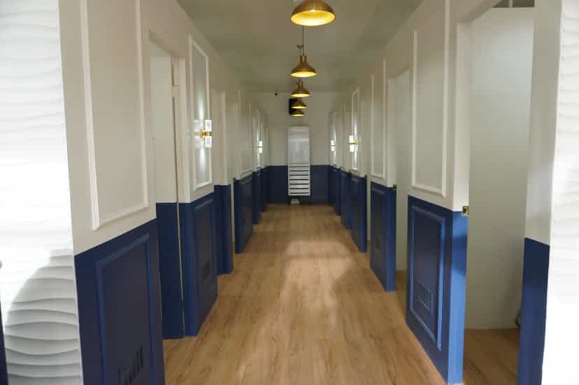 Long corridor lined with one-on-one classrooms