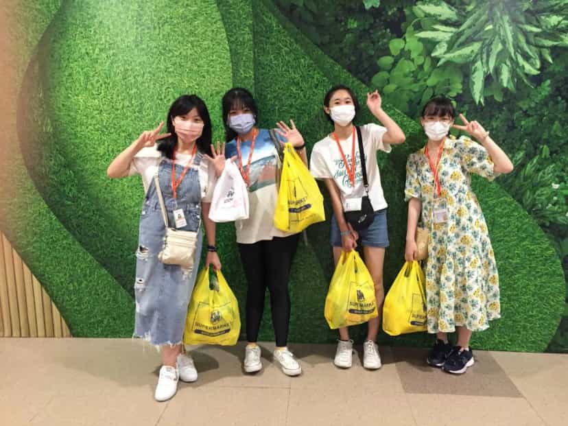CPILS students posing with shopping bags at a Cebu shopping mall