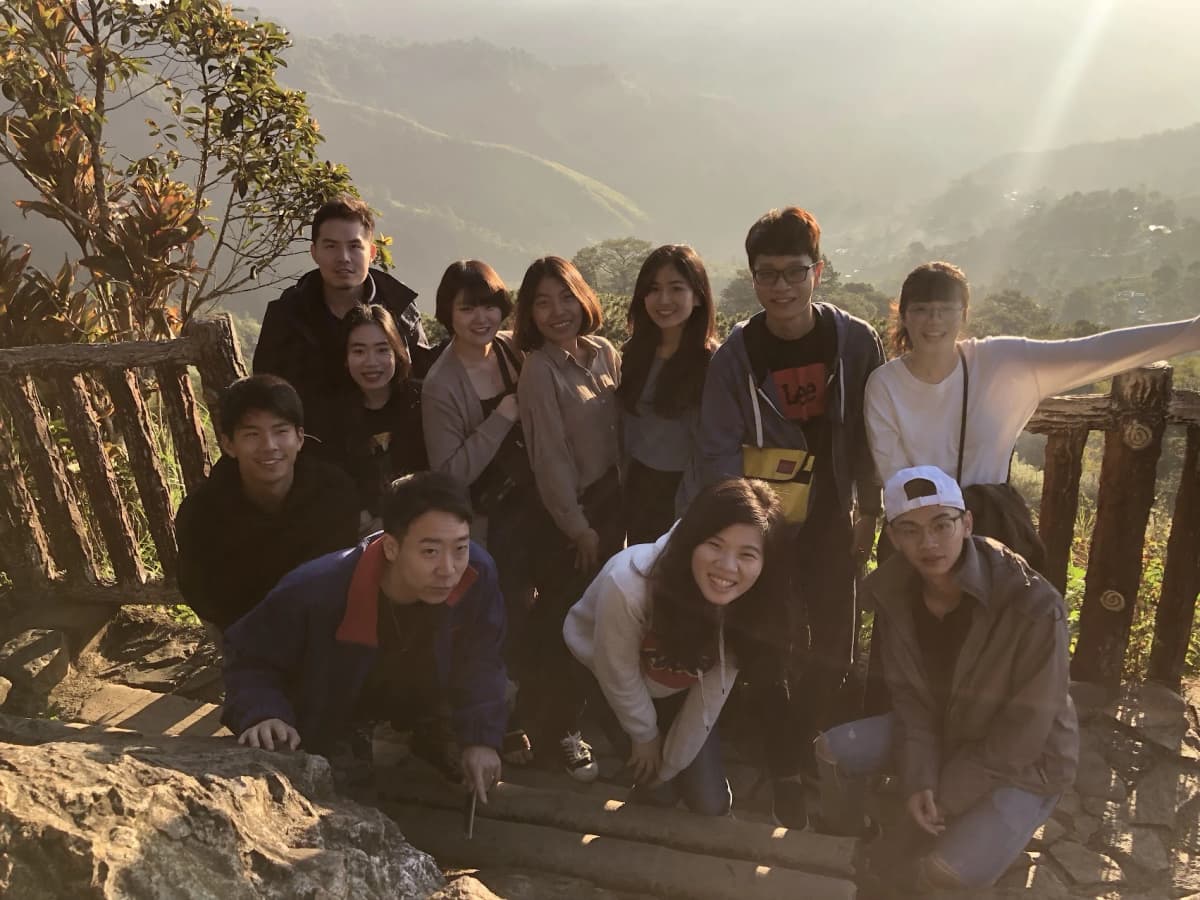 Group photo with PINES friends from different countries on a mountain trail